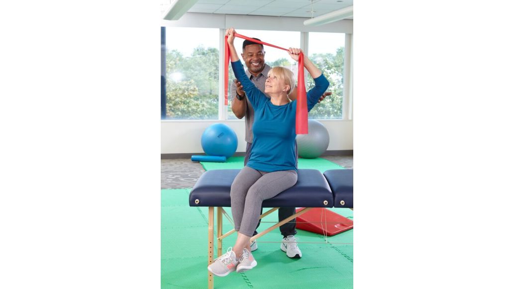 Physiotherapist working with an elderly patient