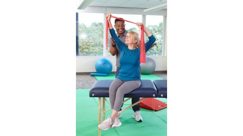 Physiotherapist working with an elderly patient