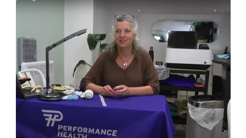 Hand therapist demonstrating thermoplastic splint for rheumatoid arthritis using Rolyan bath